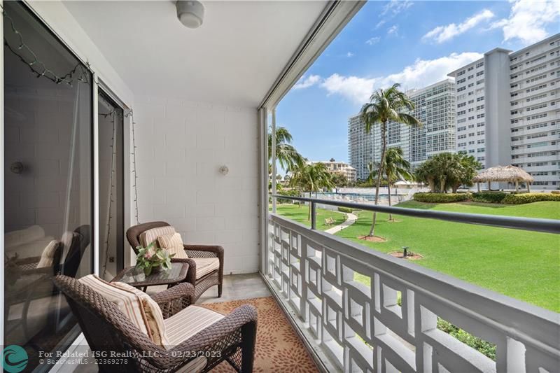 Balcony with views of the well-maintained grounds and year-round heated pool.