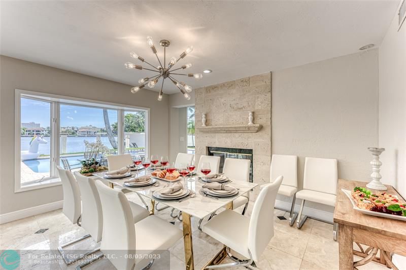 Dining Room Seating for 8 of Kitchen overlooking pool & waterway.