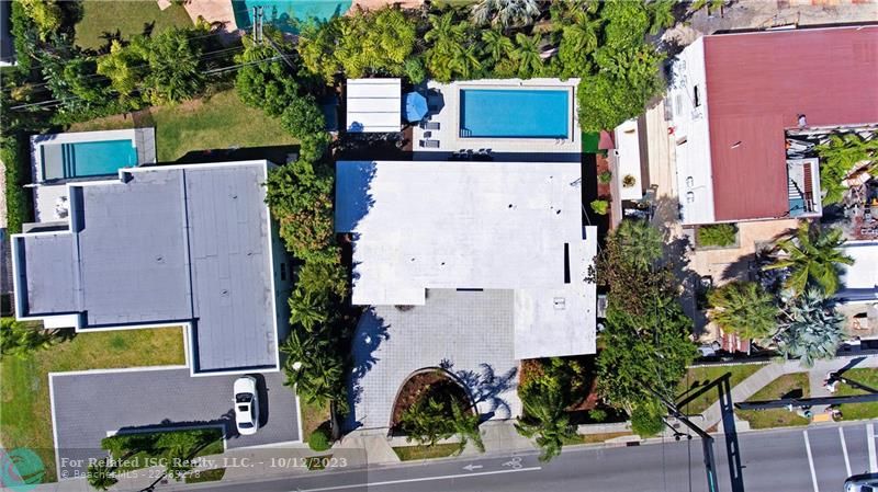 Ariel shot of property with view of oversized pool.