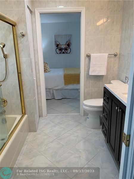 Jack and Jill Bathroom with Tub/Shower Combo.