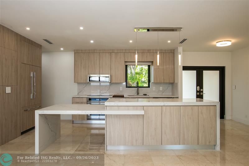 Stunning kitchen with elongated quartz island