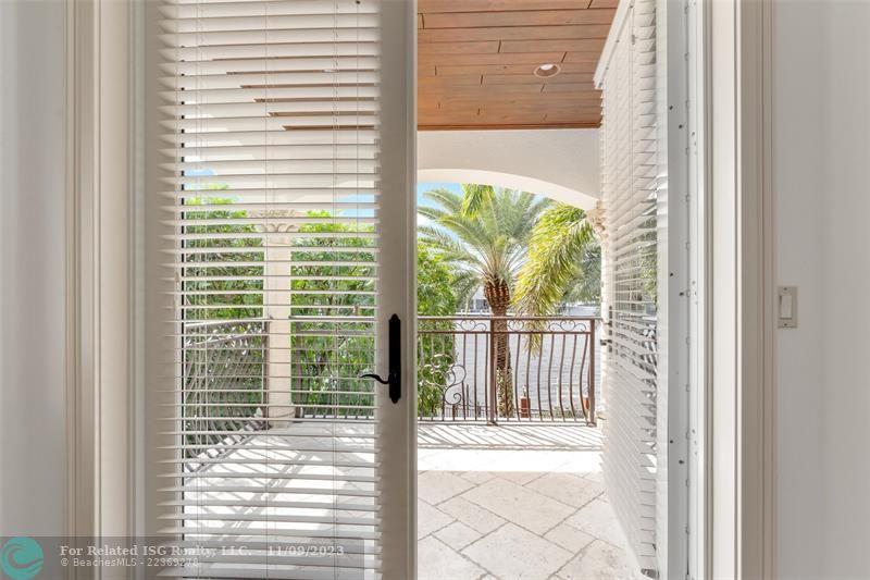 Second Level Ensuite Bedroom with balcony overlooking waterfront