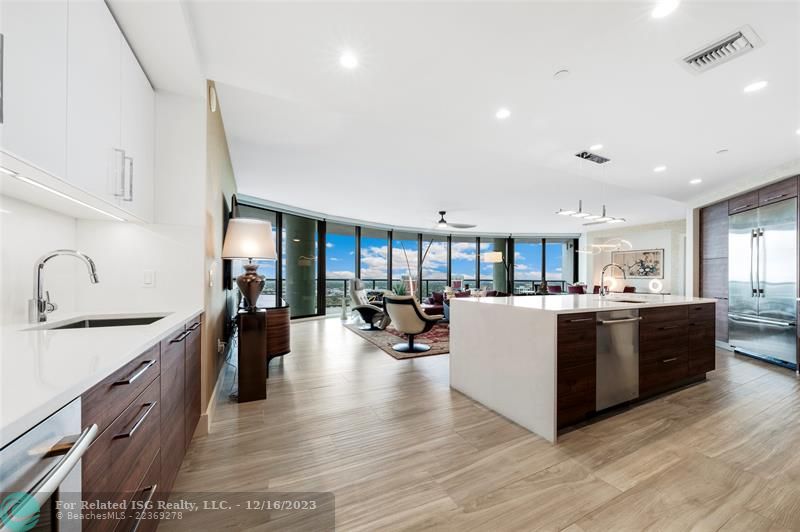 Incredible sweeping city + water view in this open flow condo