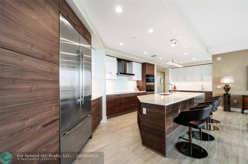 Gorgeous kitchen with Nolte cabinetry, tons of storage, large waterfall island, wet bar & amazing views!