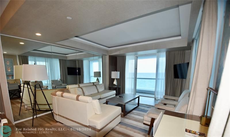 Living room w/ access to direct ocean terrace