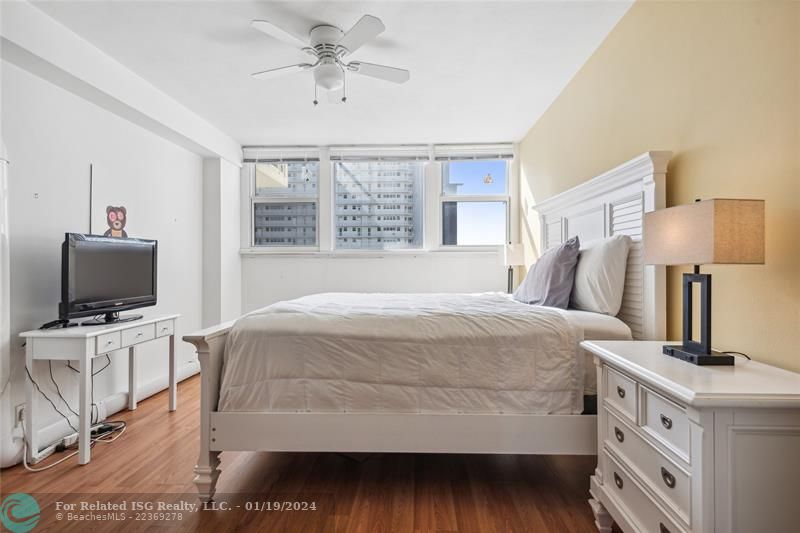 Bright, spacious bedroom with views of the port and the ocean.