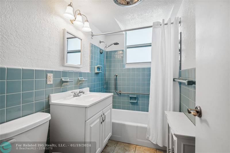 Large, bright bathroom with brand new ADA compliant toilet.