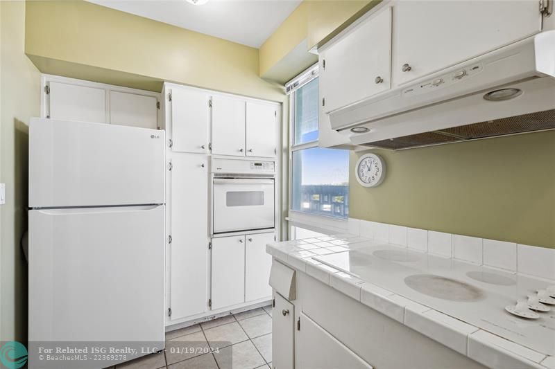 Bright kitchen with impact windows, dishwasher (5 years old) fridge (1 year old) garbage disposal (1 year old).