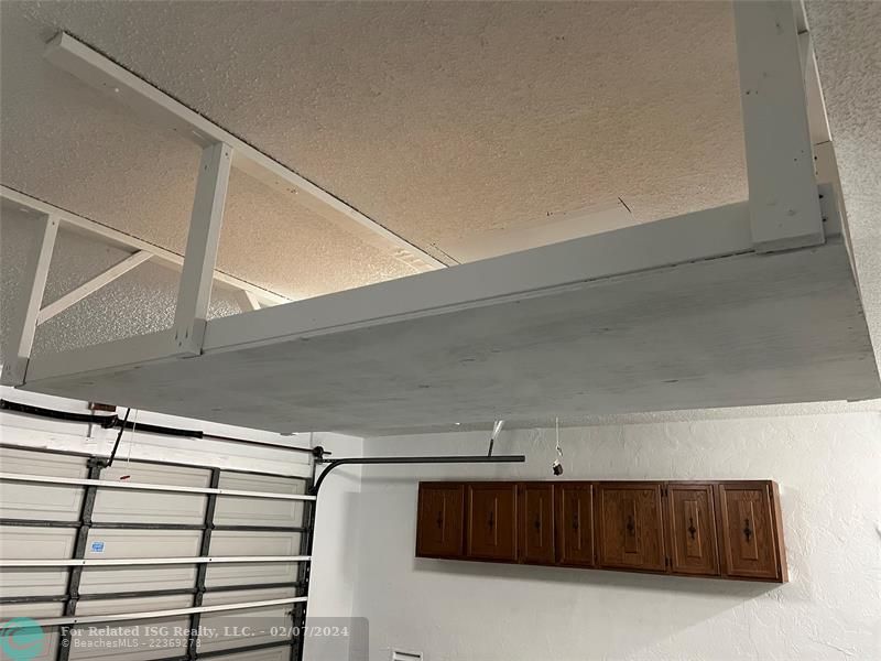 Garage showing extra storage near ceiling