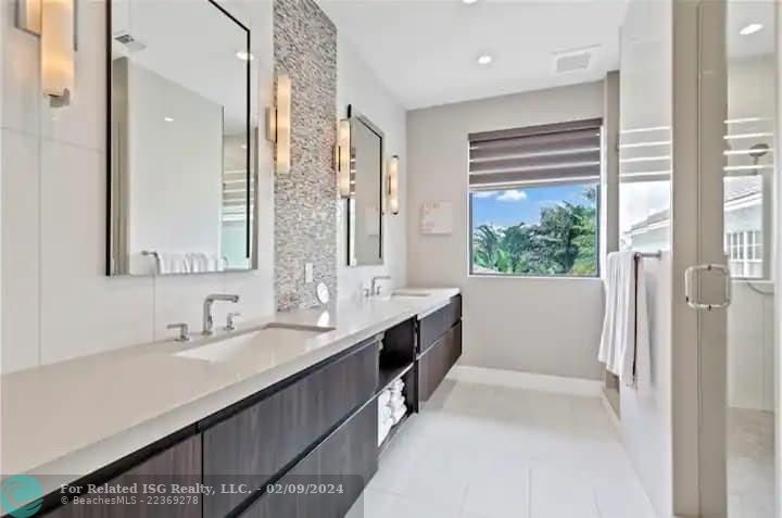 En Suite Primary Bathroom #1 with Double Sink & Shower.