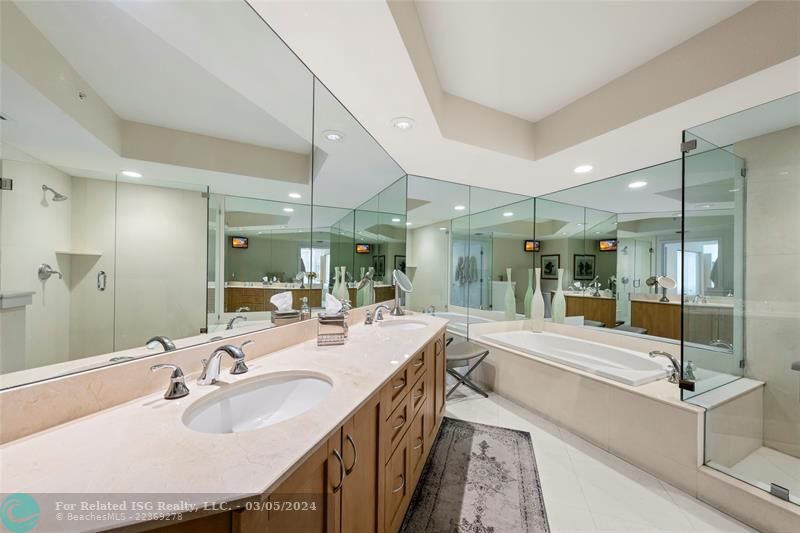 Primary bath features dual sinks, soaking tub and separate shower