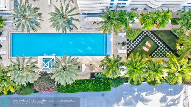 Overview, pool and cabanas. 208S is located to the right, behind the palms