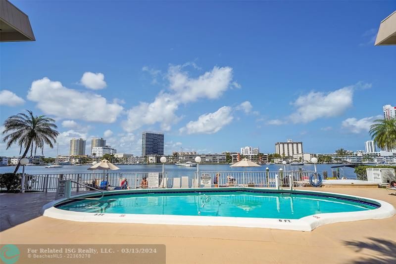 Relax by the pool overlooking Golden Isles Lake