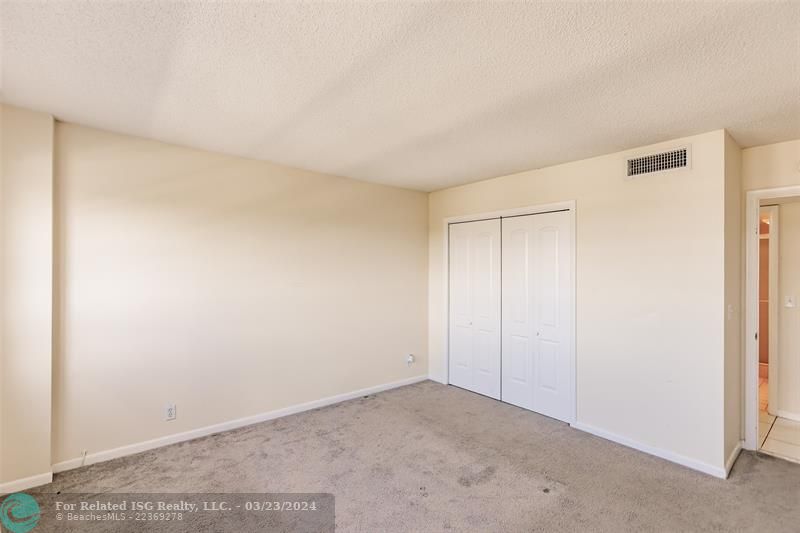 Double closets in secondary bedroom