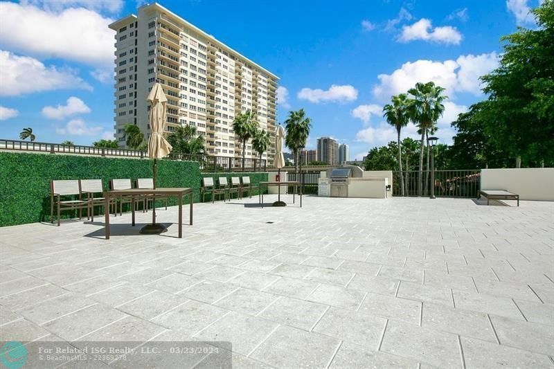 BBQ area by the pool and lounge area