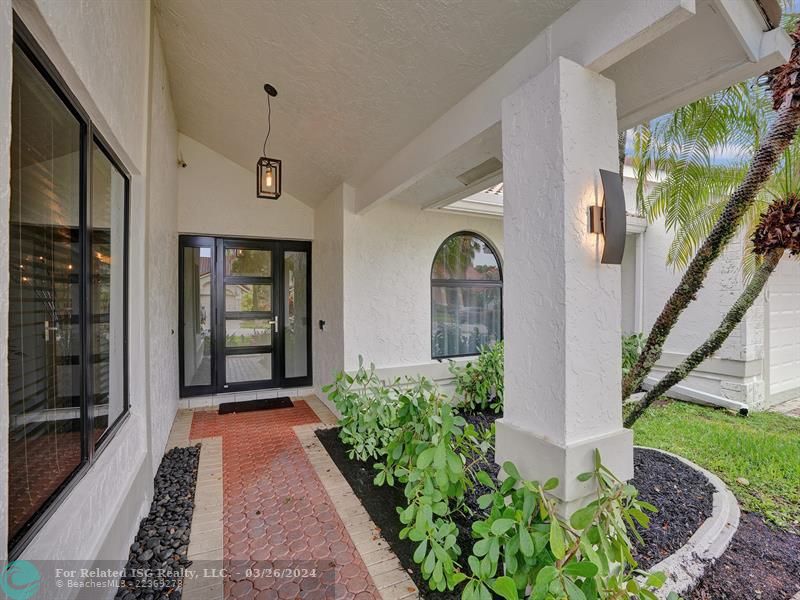 Gorgeous covered  front door entrance (new impact doors and windows)