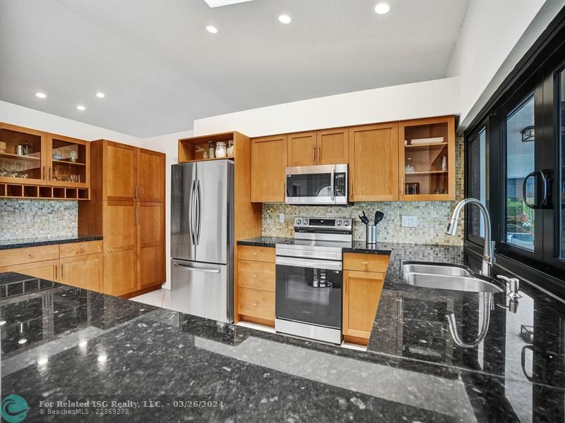 Granite counter tops / stainless appliances/wood cabinets