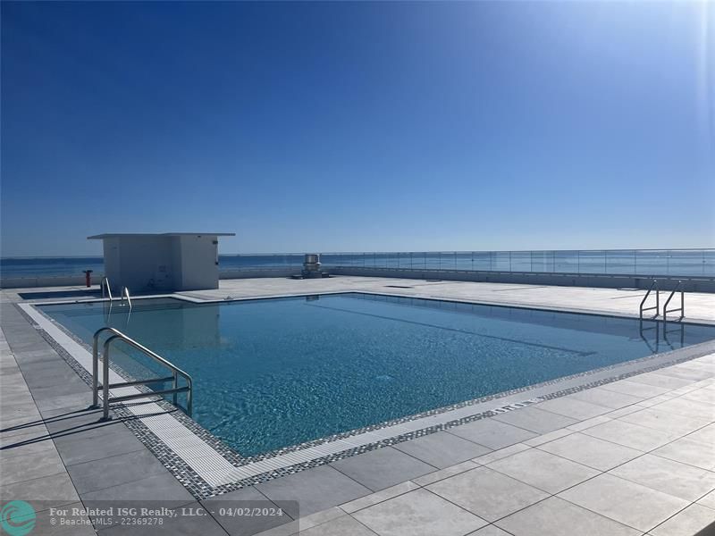 Roof-Top Pool featuring Glass Railing for Panoramic Views