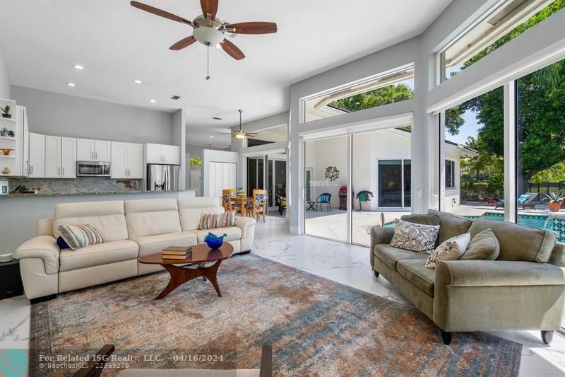 Warm and welcoming family room abuts kitchen and tranquil patio views!