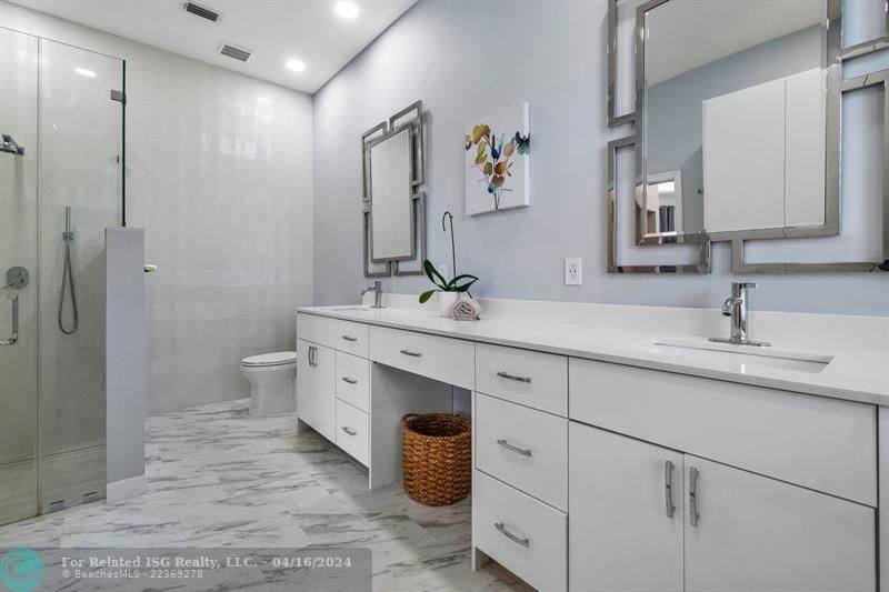 Gorgeous primary bathroom fit for royalty with added storage area!