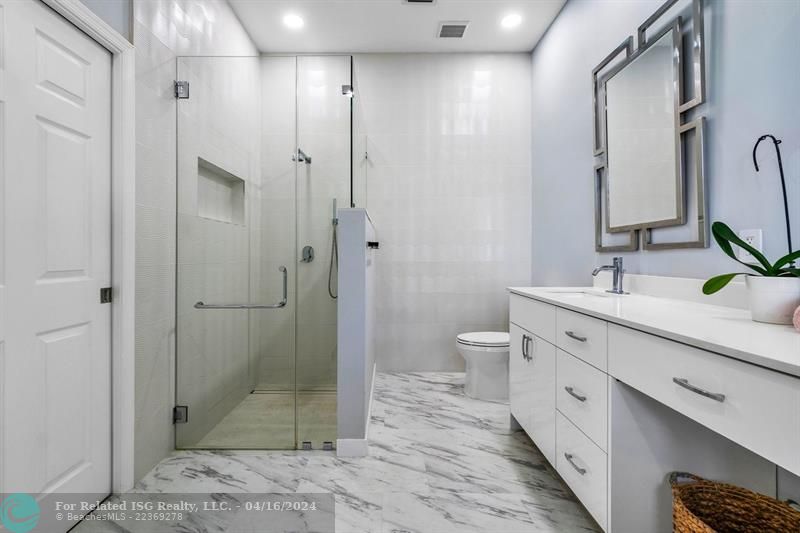Framelss shower in primary bathroom with designer touches throughout!