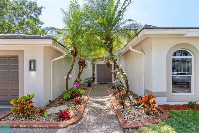 Double Door entry welcomes you home! Lushly landscaped, ALL IMPACT! NEW ROOF!!