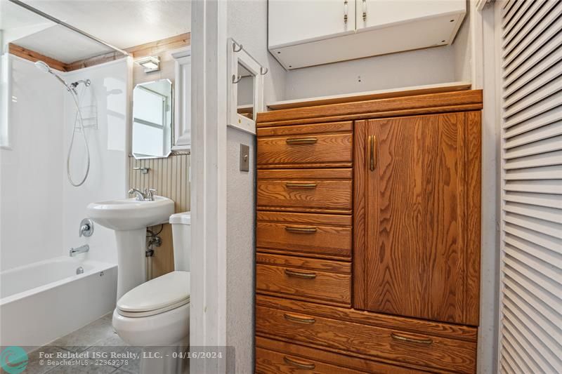 Bright bathroom with storage.