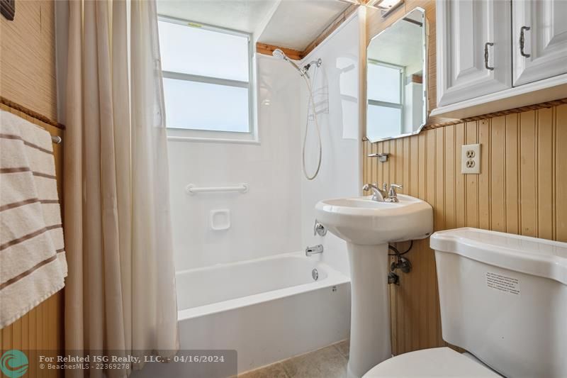 Bright bathroom with storage.