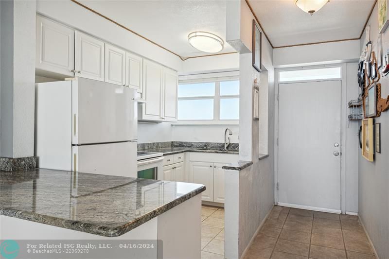 Bright kitchen that opens to your living room with a brand new range hood and oven that has never been used.