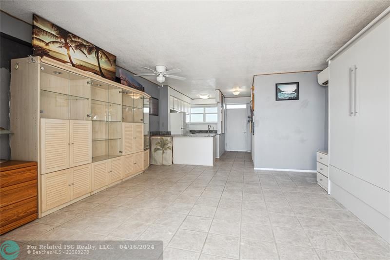 Open kitchen and living room with direct ocean views and Murphy bed.