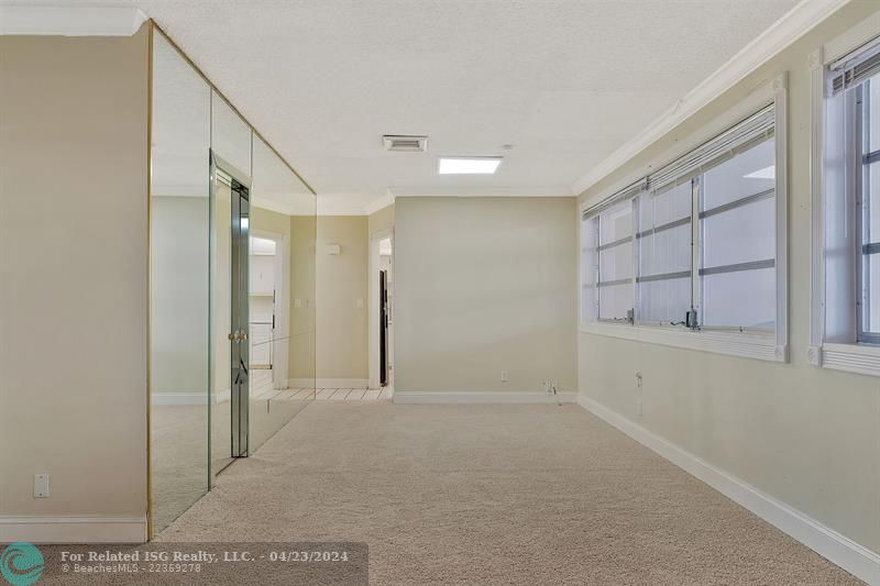 Living Room and Ding Room - Entrance to Large Walk in Closet and 1/2 Bath on the left