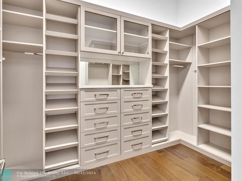 Large walk in pantry with refrigerated drawers and additional shelves on the left