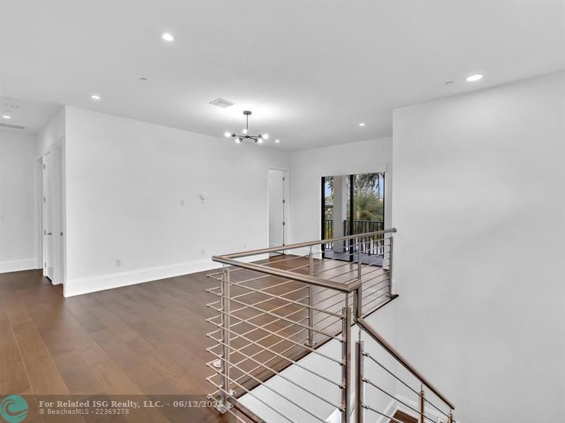 Large walk in pantry with refrigerated drawers and additional shelves on the left