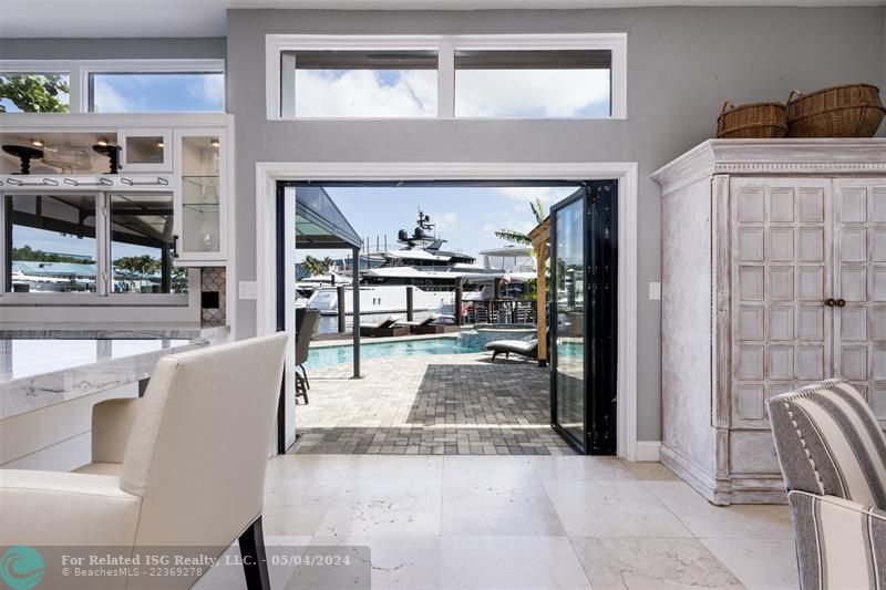 Bi-folding impact doors to the pool deck