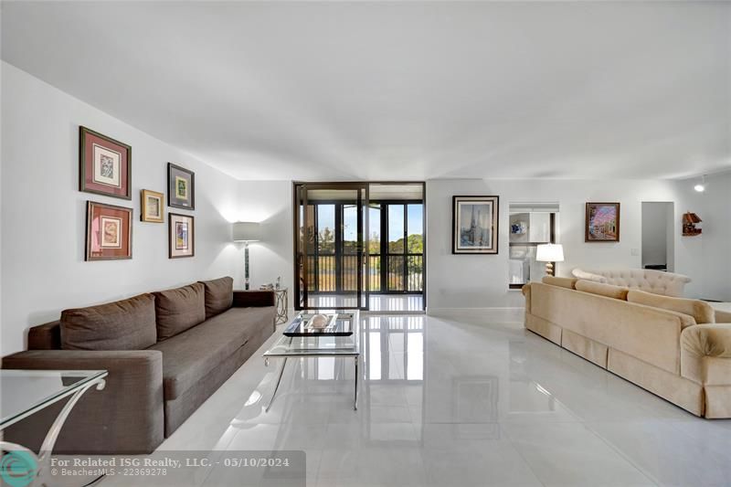 Spacious Living Room & Patio Doors To Screened Balcony