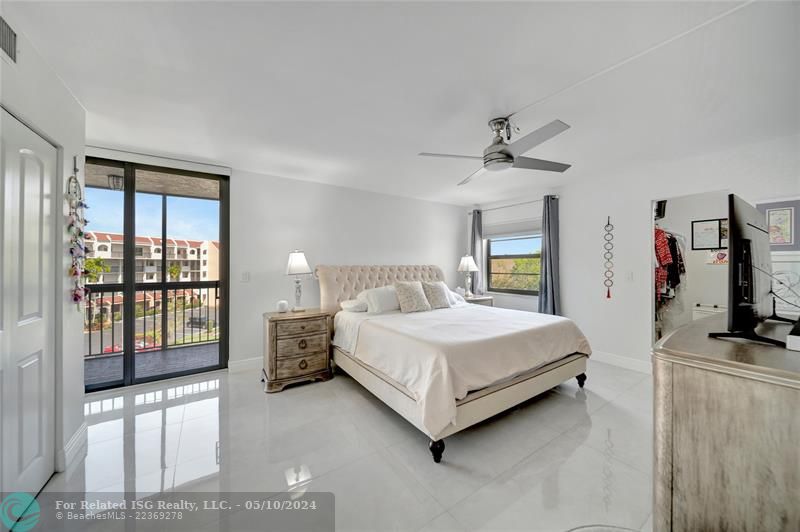 Spacious Master Bedroom with Patio Doors To Private Screened Balcony