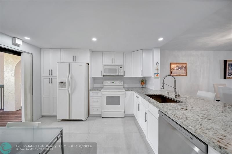 Spacious Open Kitchen with Patio Doors To Catwalk on Left