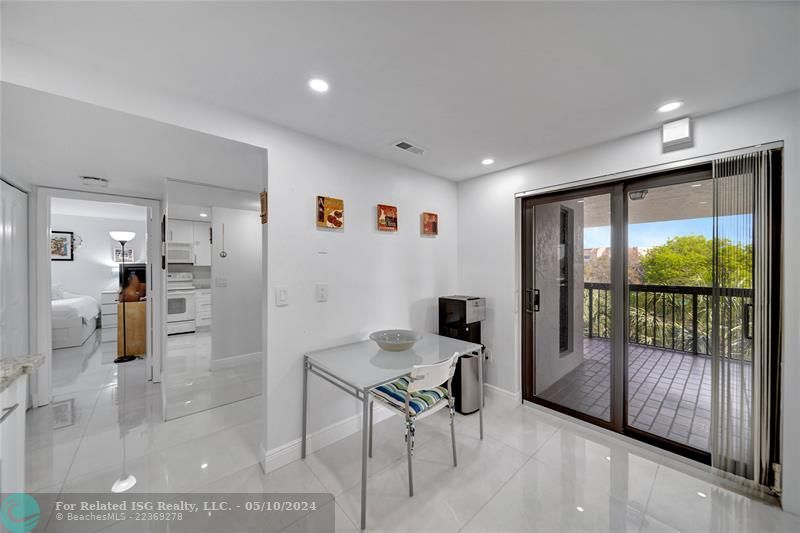 Spacious Kitchen With Patio Doors to Catwalk; Doorway to Guest Bedroom on Left