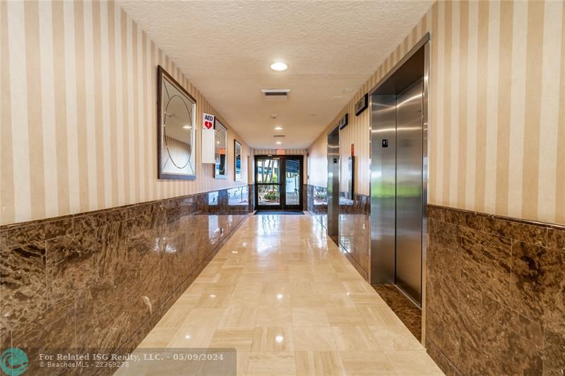 Lobby entrance and exit to pool area and sauna.