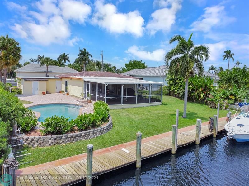 Large pool, paver patio and backyard