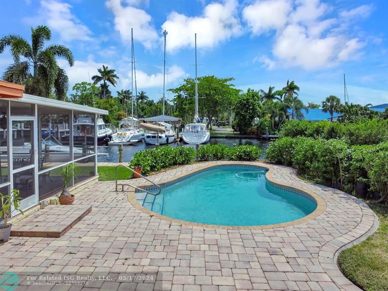 Pool with large paver patio