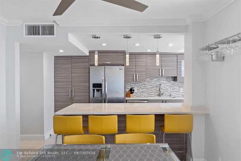 Recessed Lighting and Pendant Lighting over Quartz Breakfast Counter Bar