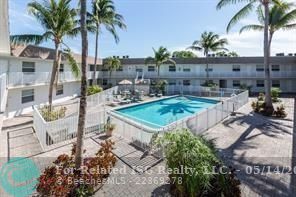 Pool with tropical landscaped courtyard