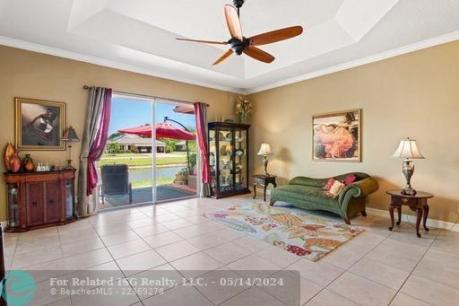 Living room with sliders to back yard and view of lake