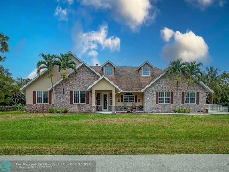 Gorgeous elevation with covered front porch situated on one acre