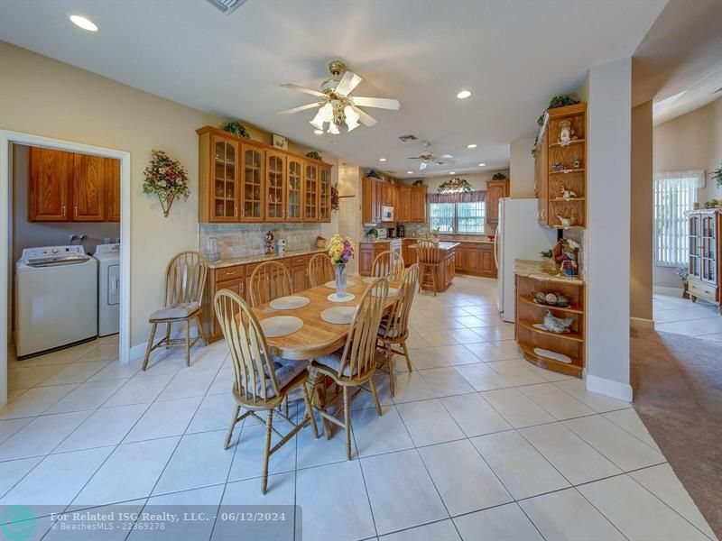 Game room, wet bar, vaulted ceilings with lots of windows and access to screened in patio