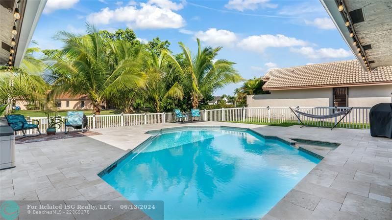 View of pool/spa and backyard from Cabana Bathroom Door