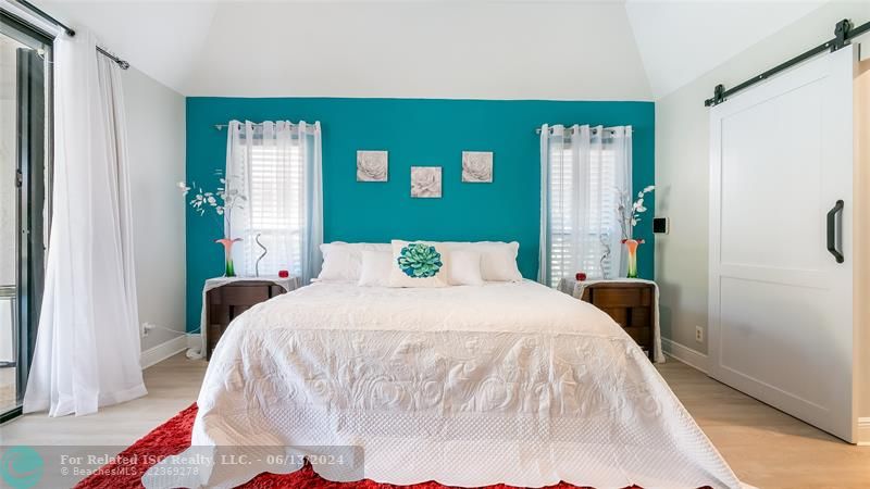 Step into the sumptuous master bedroom retreat where modern farmhouse style seamlessly blends comfort and luxury. Bright and airy, this generously sized sanctuary is awash in warm natural light .