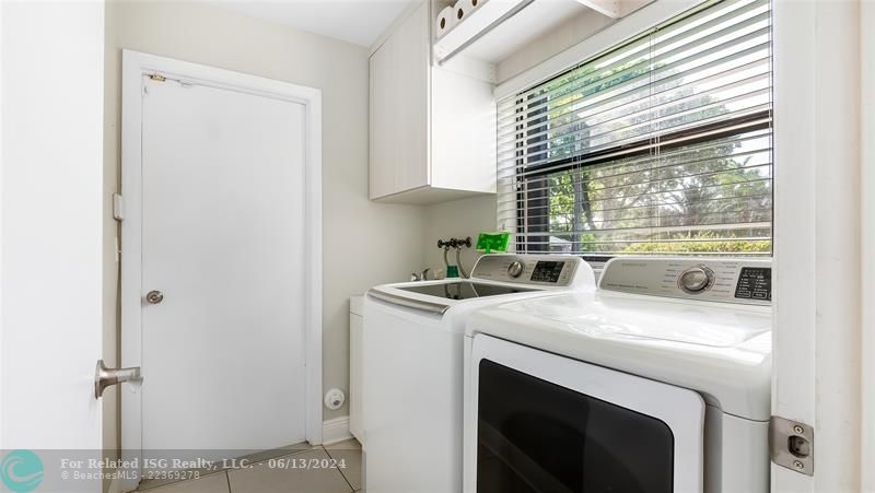 The laundry room is a model of efficiency, with ample storage and an intuitive layout that streamlines your household chores.