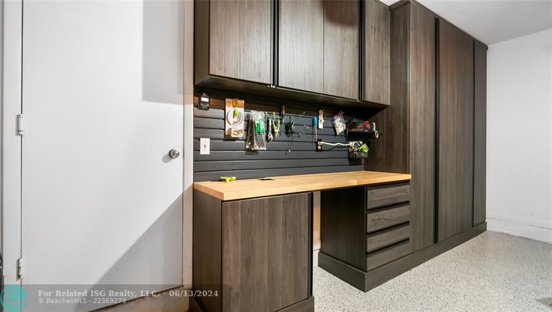 Step into the garage, and you'll find an expansive workbench, complete with high-grade tools and storage solutions, making it an ideal space for both DIY enthusiasts and professional craftspeople.